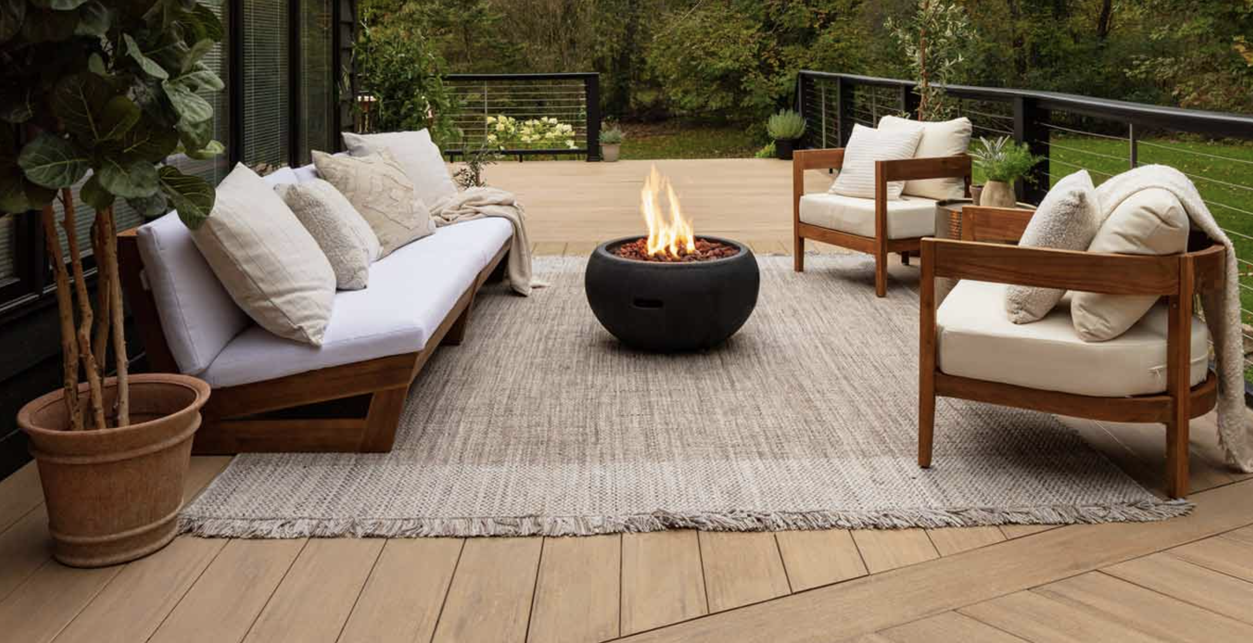 Beautiful deck with outdoor furniture and fire pit. Rogall + Co. your central California coast deck and painting experts